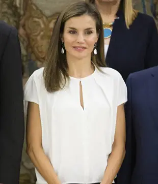 Queen Letizia brought her somber wardrobe out for the last engagement before annual vacation