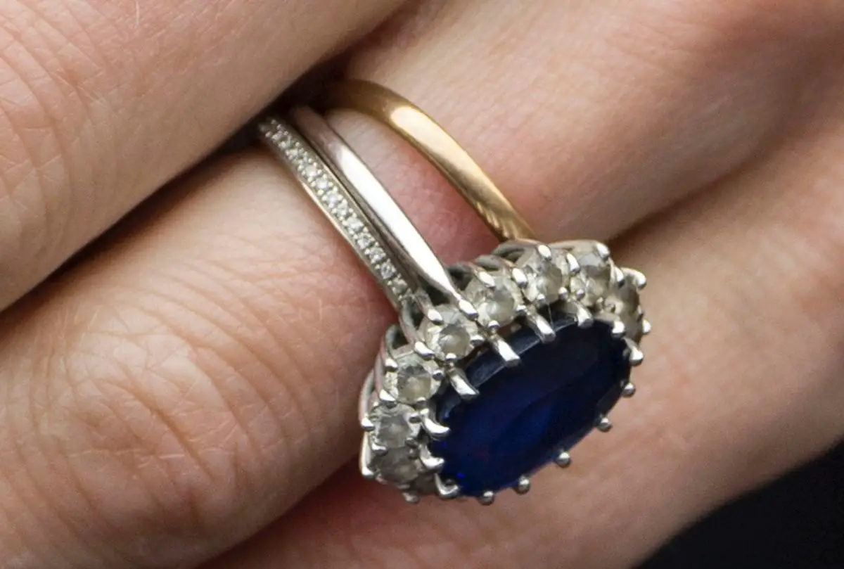 The Duchess of Cambridge wears three rings on her ring finger - Welsh Gold Wedding Ring, Sapphire and Diamond Engagement Ring and Annouska Eclipse 18ct White Gold Diamond Eternity Ring