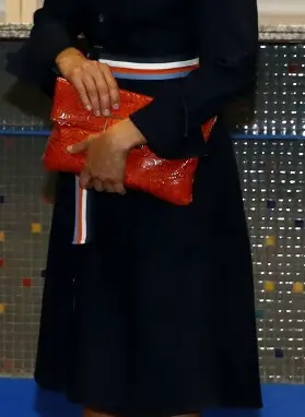 Queen Letizia carried Angel Schlesser orange croc-embossed clutch bag