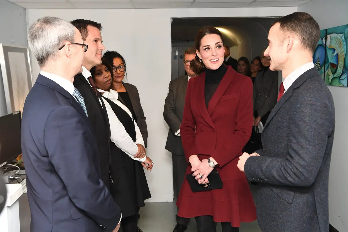 The Duchess of Cambridge in burgundy Paula Ka suit for UCL Visit