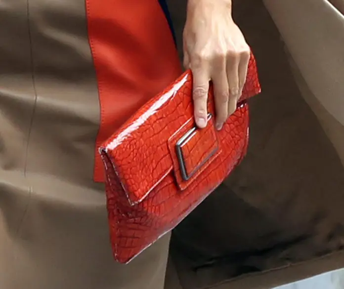 Queen Letizia was carrying her Angel Schlesser Croc- embossed orange handbag