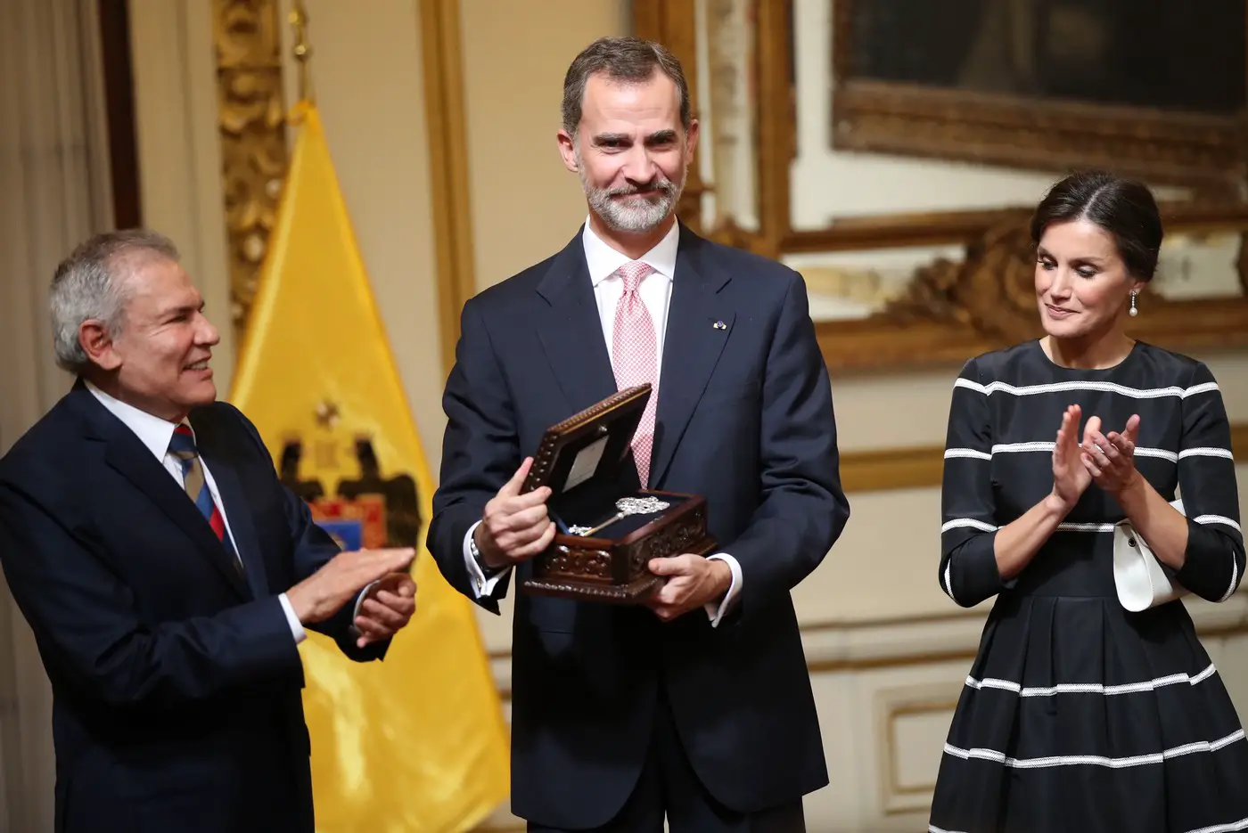 Queen Letizia of Spain wore black Carolina Herrera Dress with white stripes on it to Peru