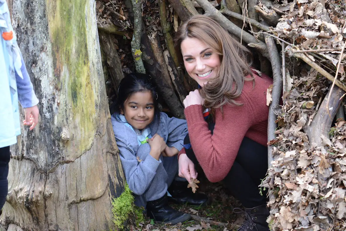 The Duchess of Cambridge joined a little one in a den built against a tree