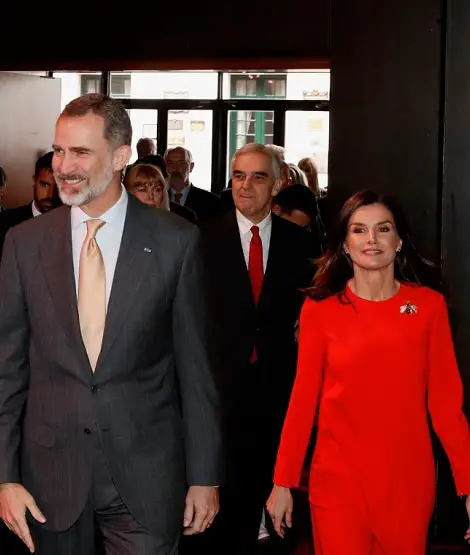 Queen Letizia wore orange red top and pants during Argentina visit