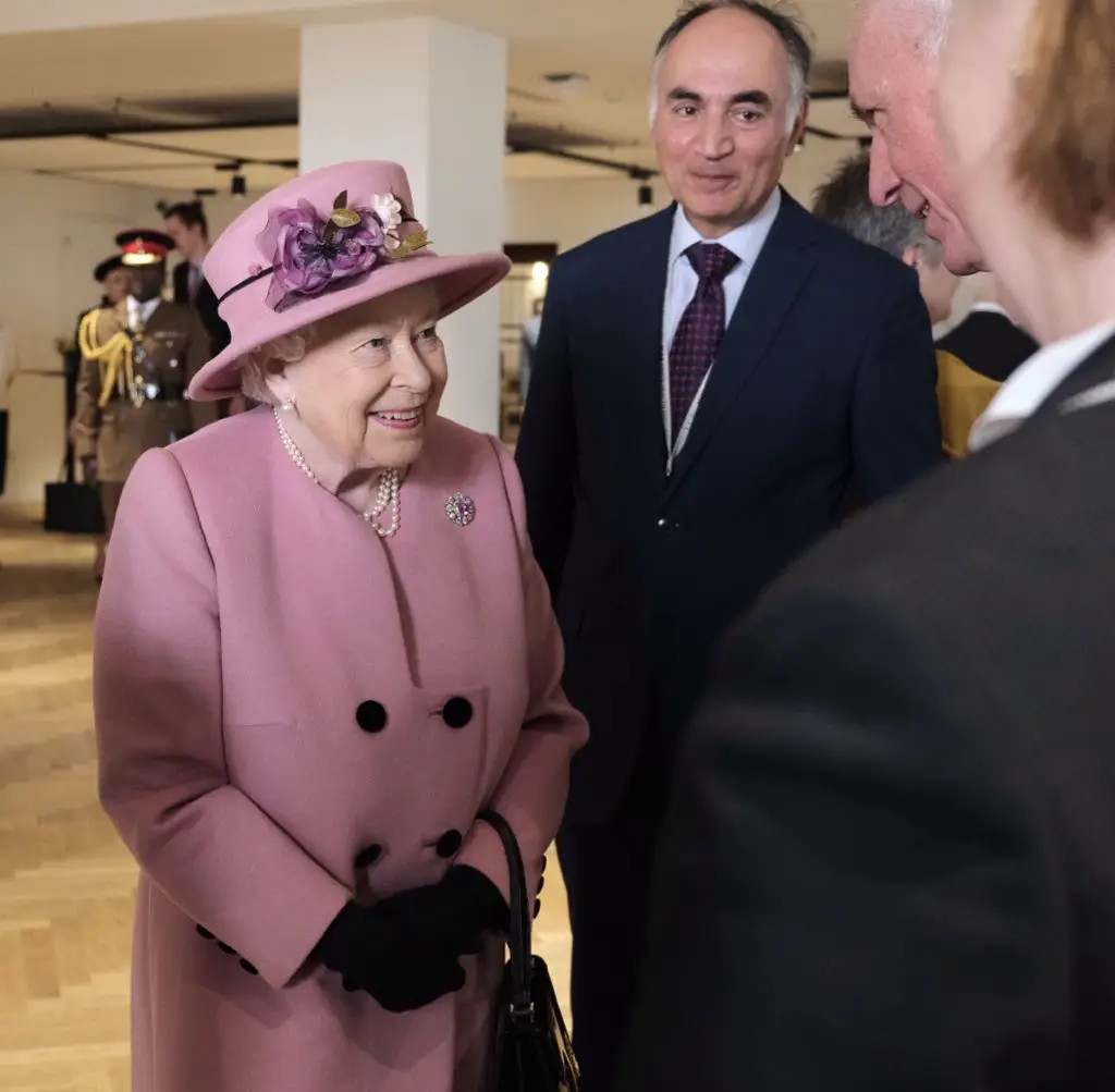 Queen Elizabeth looked lovely in a pink outfit.