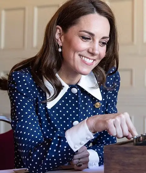 The Duchess of Cambridge wore blue Alessandra Rich Polka dot Dress to visit Bletchley Park in May 2019