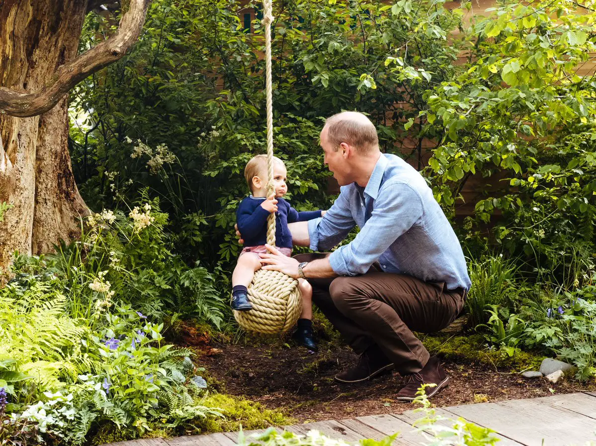 Then Papa William took little Louis for a swing around who looks little less than impressed