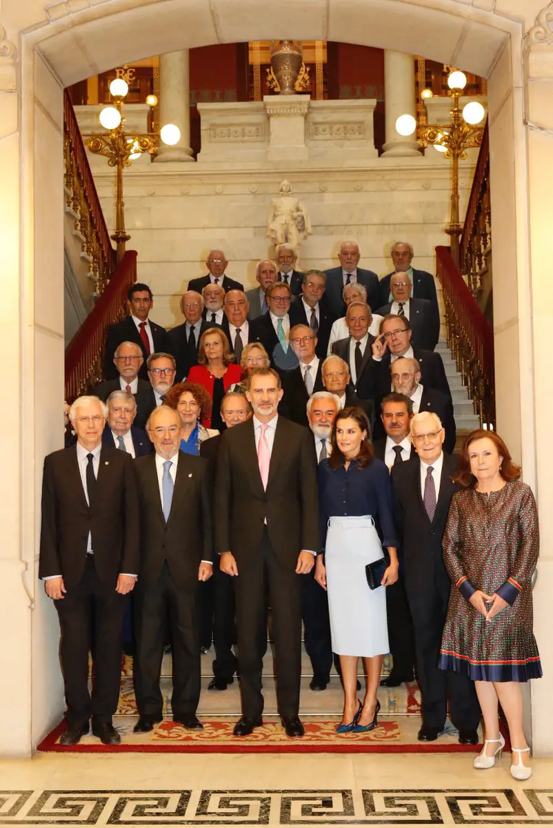 Queen Letizia of Spain in Felipe Varela Blue button down shirt and Hugo Boss High-waisted Pencil belted sky blue skirt for Royal Spanish Academy Meeting