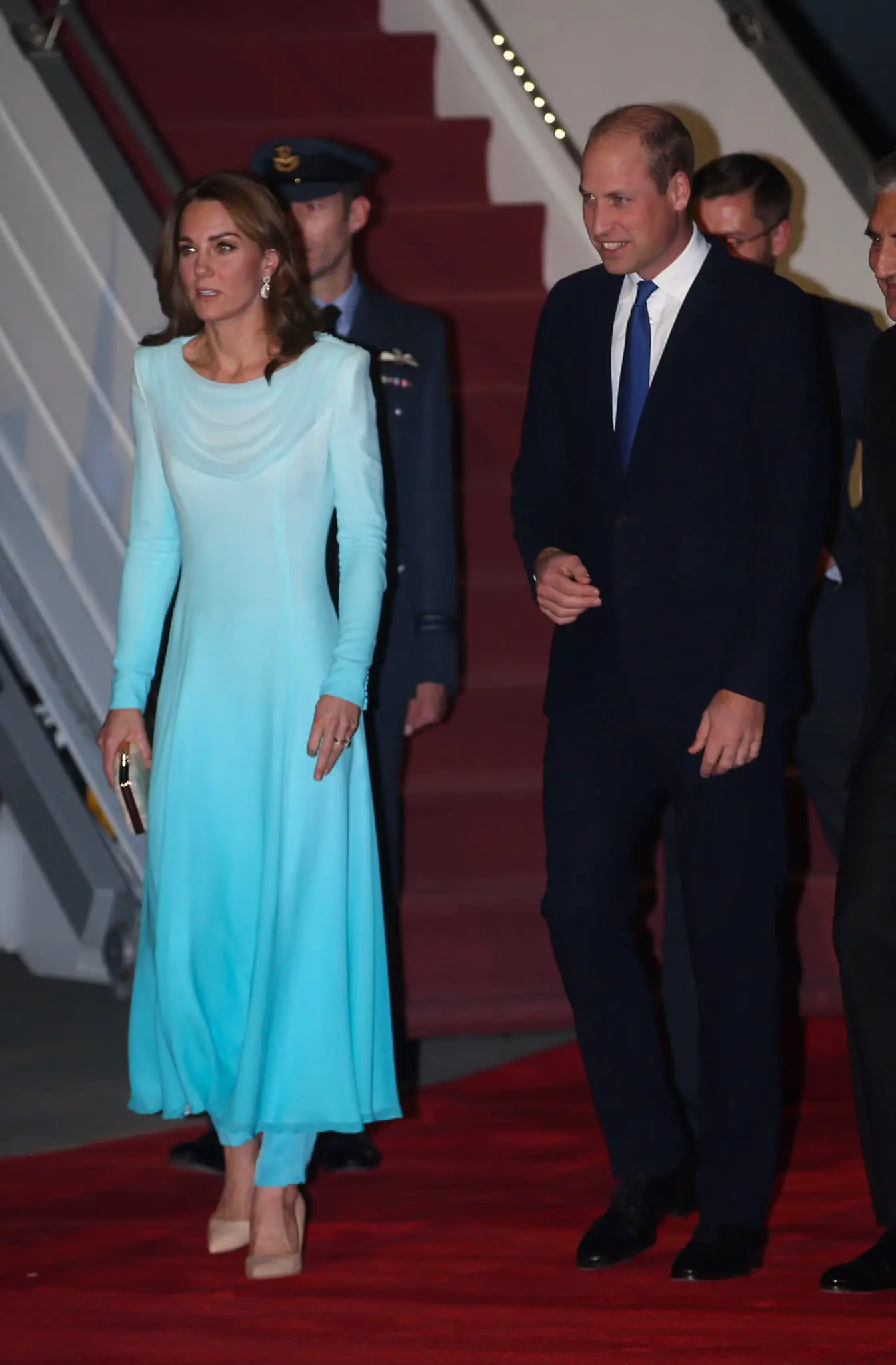 The Duke and Duchess of Cambridge arrived in Pakistan. The Duchess of Cambridge is wearing a Catherine Walker Tunic and Trouser