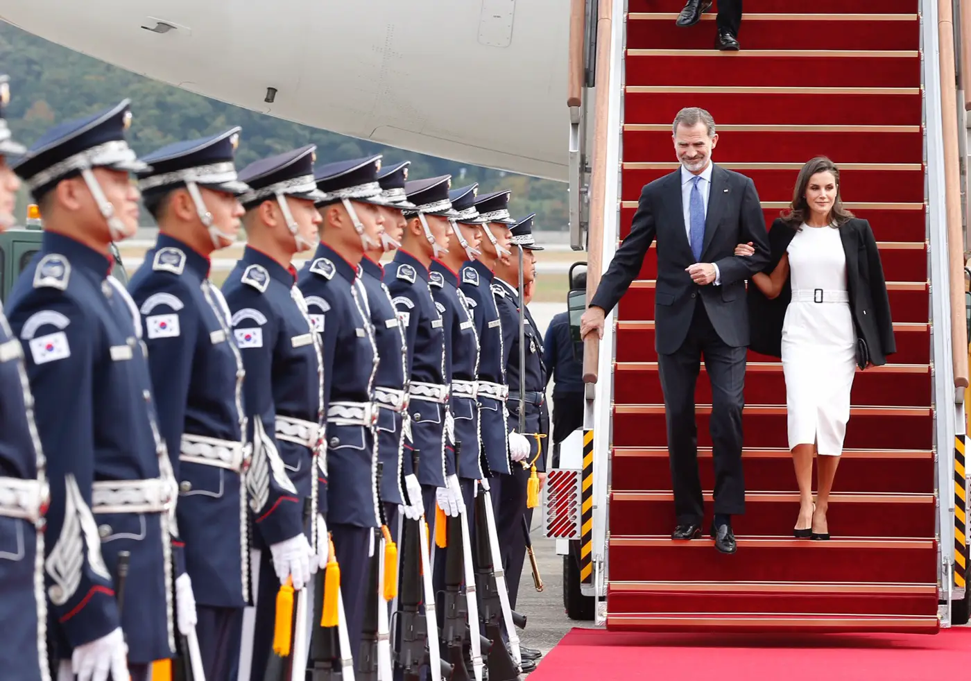 Queen Letizia wore Boss Dadoria Belted Sheath Dress to arrive in South Korea