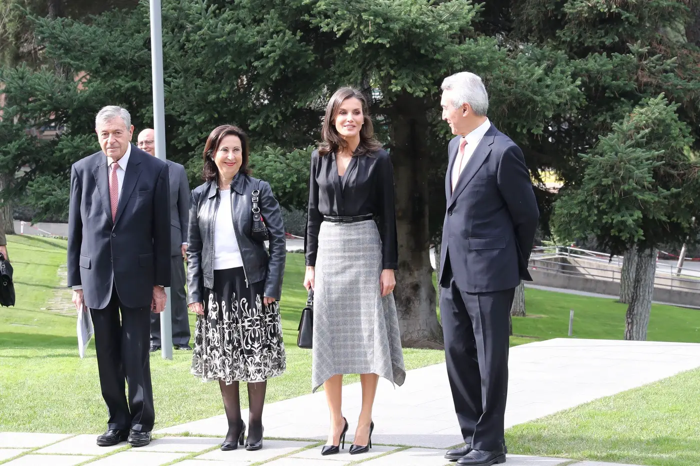 Queen Letizia of Spain presented friendship awards wearing black blouse and gray skirt