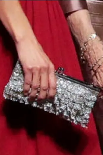 Queen Letizia was carrying a silver jeweled clutch