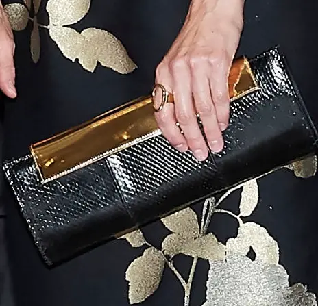 Queen Letizia carried Magrit Alice black and golden snake-skin clutch
