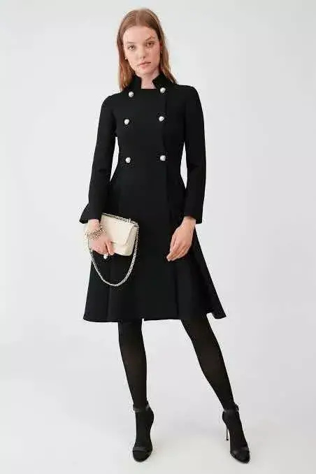 Queen Letizia wore Carolina Herrera black double breasted wool coat