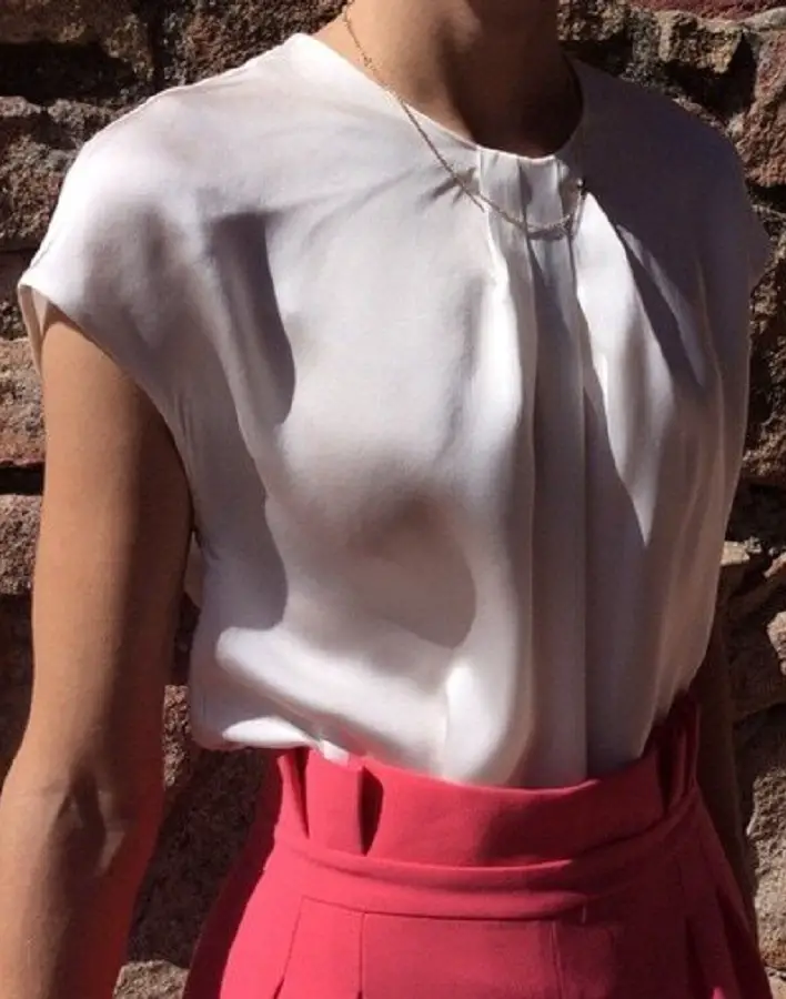 Queen Letizia wore Carolina Herrera cap sleeve silk blouse with pleated neckline