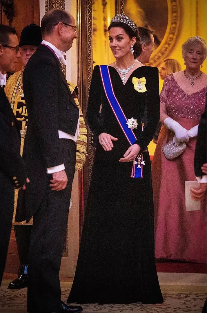 The Duchess of Cambridge was wearing a new navy velvet gown by her go-to designer Alexander McQueen at the Diplomatic Reception with Lover's Knot Tiara