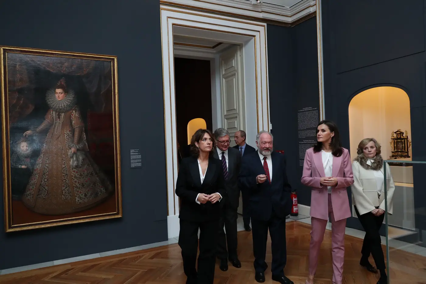 Queen Letizia wore soft petal pink Hugo Boss suit at the Palace Exhibition