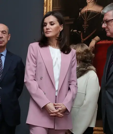 Queen Letizia wore soft petal pink Hugo Boss suit at the Palace Exhibition