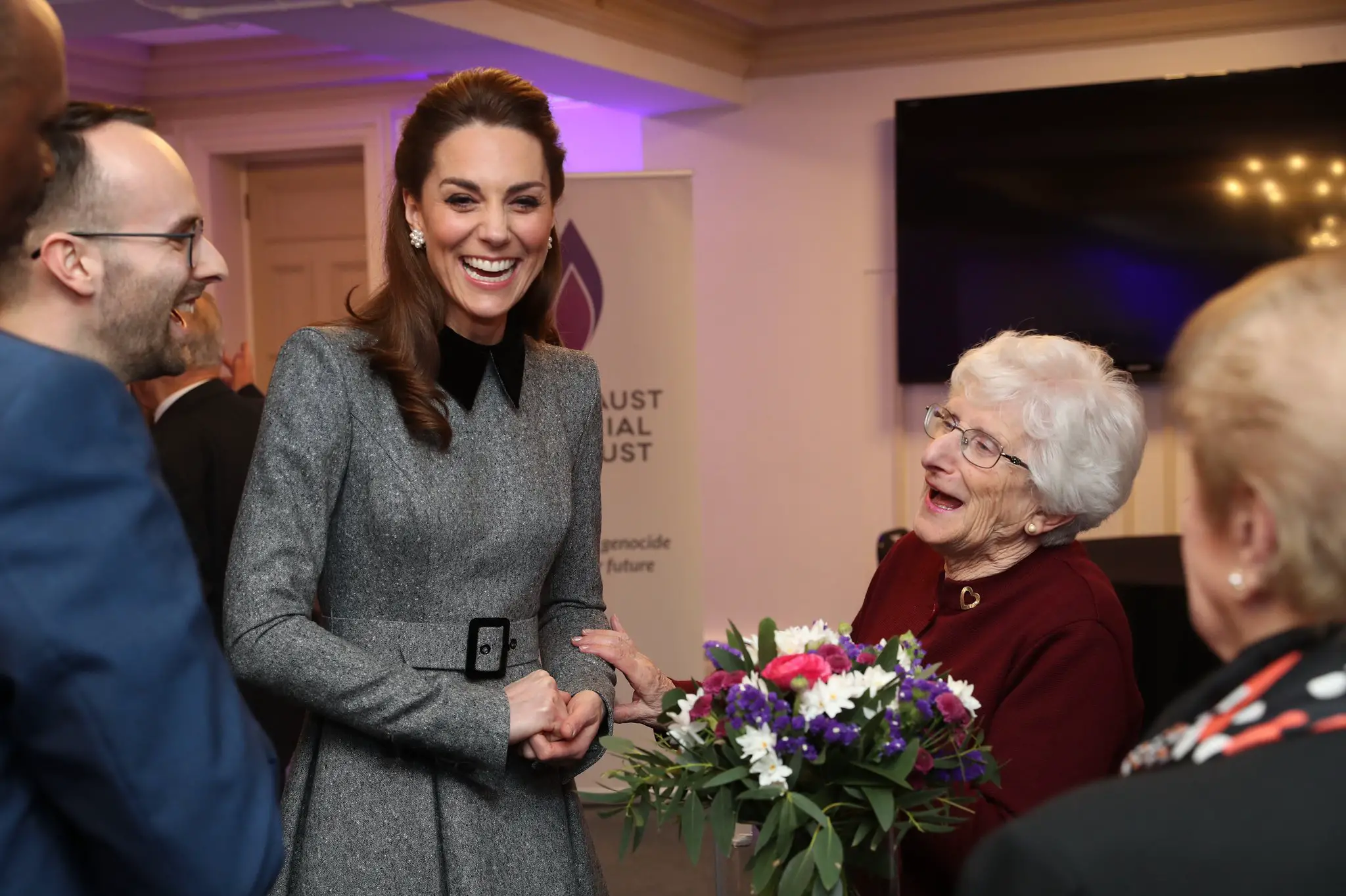 The Duchess of Cambridge shares a joke with Holocaust survivor Yvonne Bernstein after the UK Holocaust Memorial Day