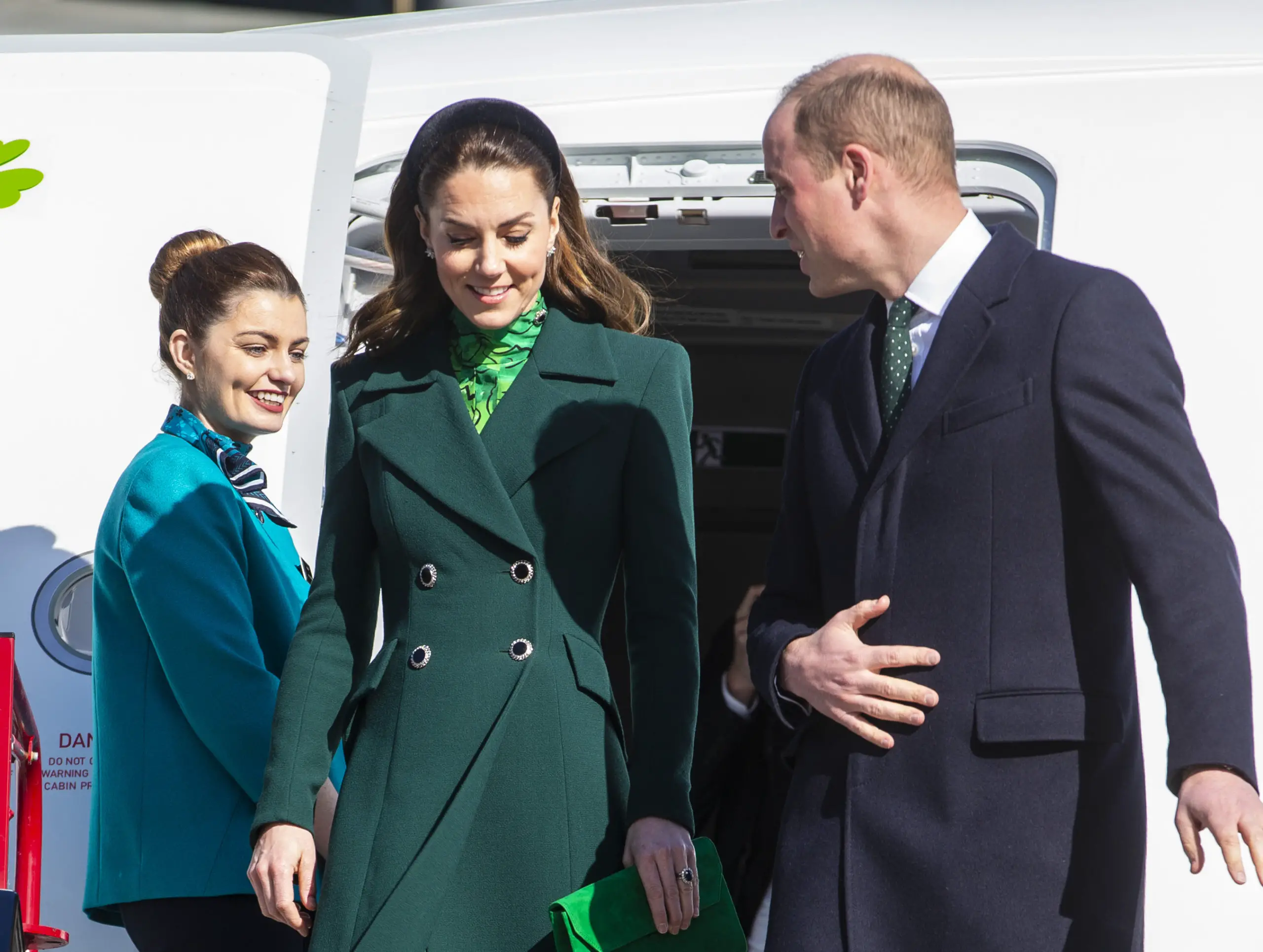 The Duke and Duchess of Cambridge walk down the steps of the plane as they arrive at Dublin International Airport ahead of their three day visit to the Republic of Ireland.