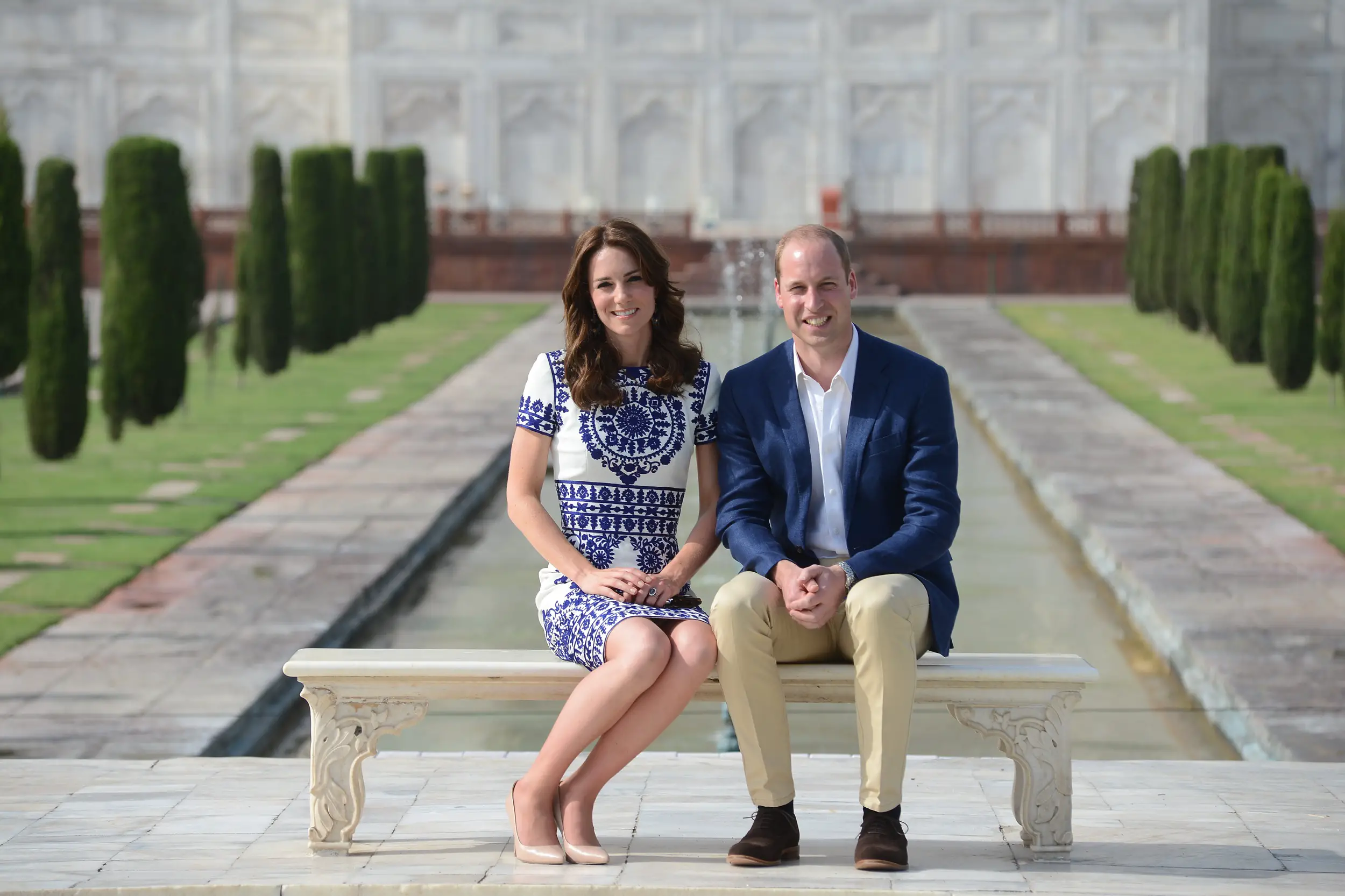 The Duke and Duchess of Cambridge sitting at the Iconic Bench of The Taj Mahal in India