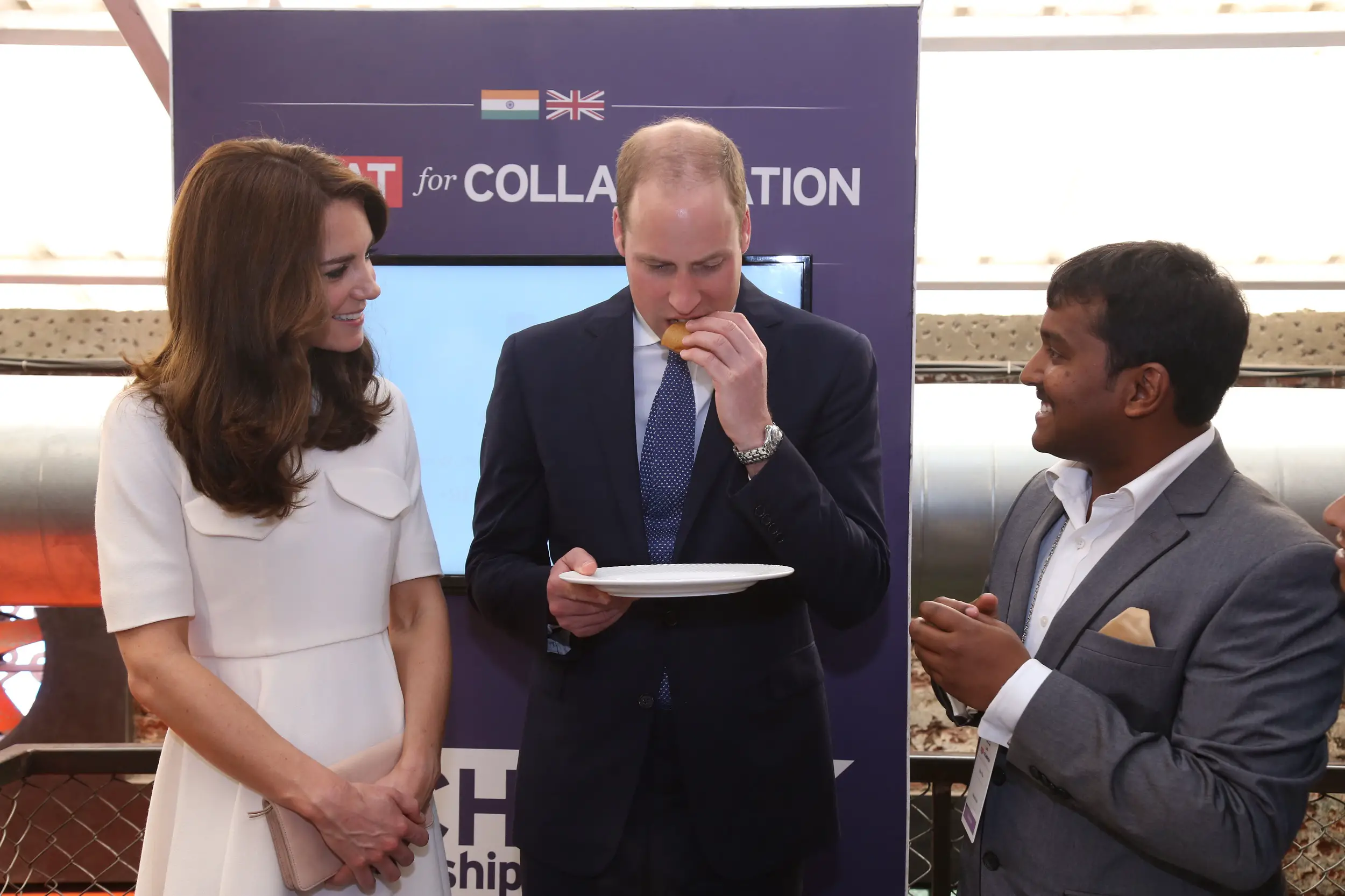 William tasted the dosa while Catherine politely declined the offer.