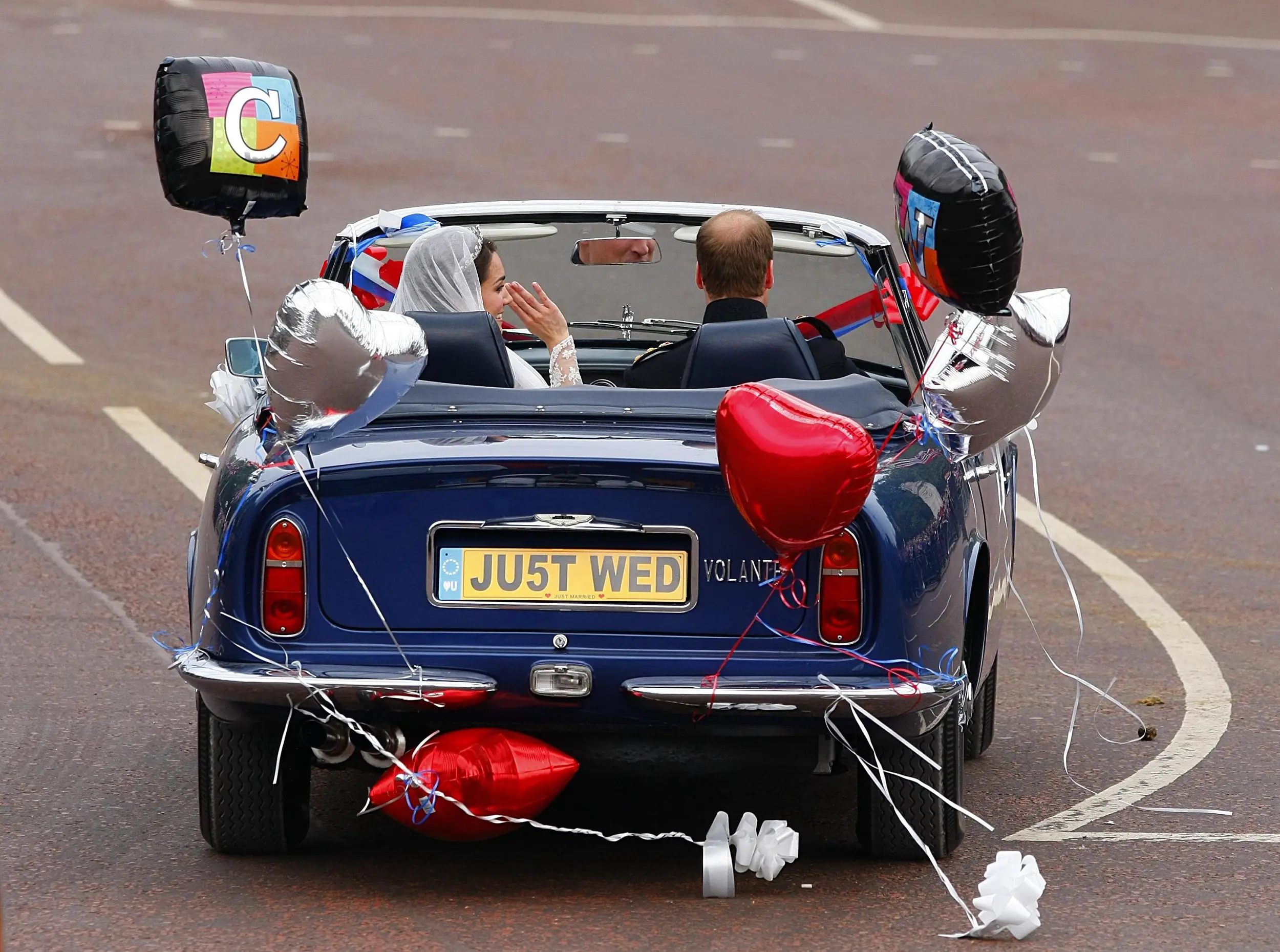 Prince William drove his wife Catherine as they leave Buckingham Palace for Clarence House.