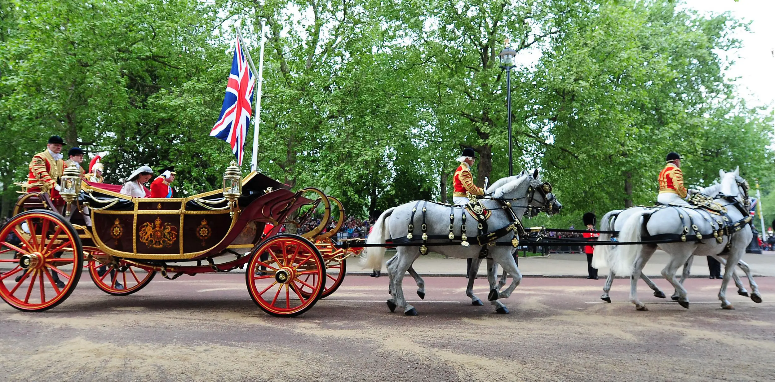 Prince William and his bride Catherine travel down The Mall after being married at Westminster Abbey in central London.