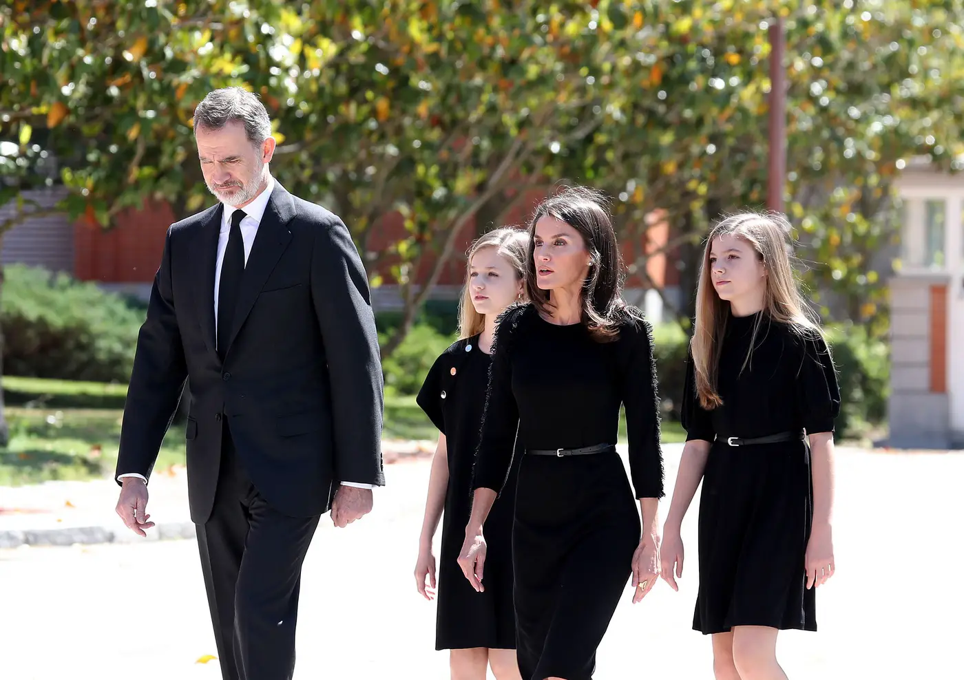 King Felipe and Queen Letzia accompanied by their daughters, at the end of the flag-lowering ceremony and minute of silence that took place at the Palacio de La Zarzuela