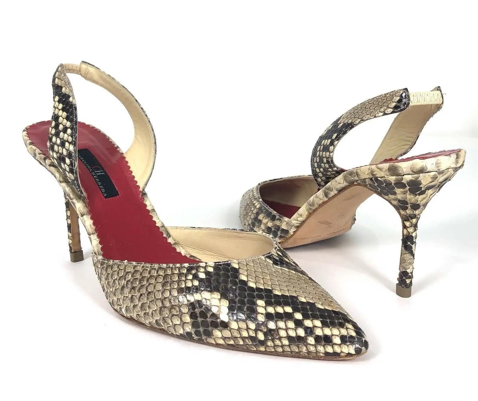 Queen Letizia of Spain wore Carolina Herrera python leather Initials Insignia Slingback pumps
