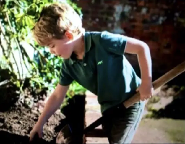 Prince George held a spade in his hands while doing gardening in Prince William's documentary