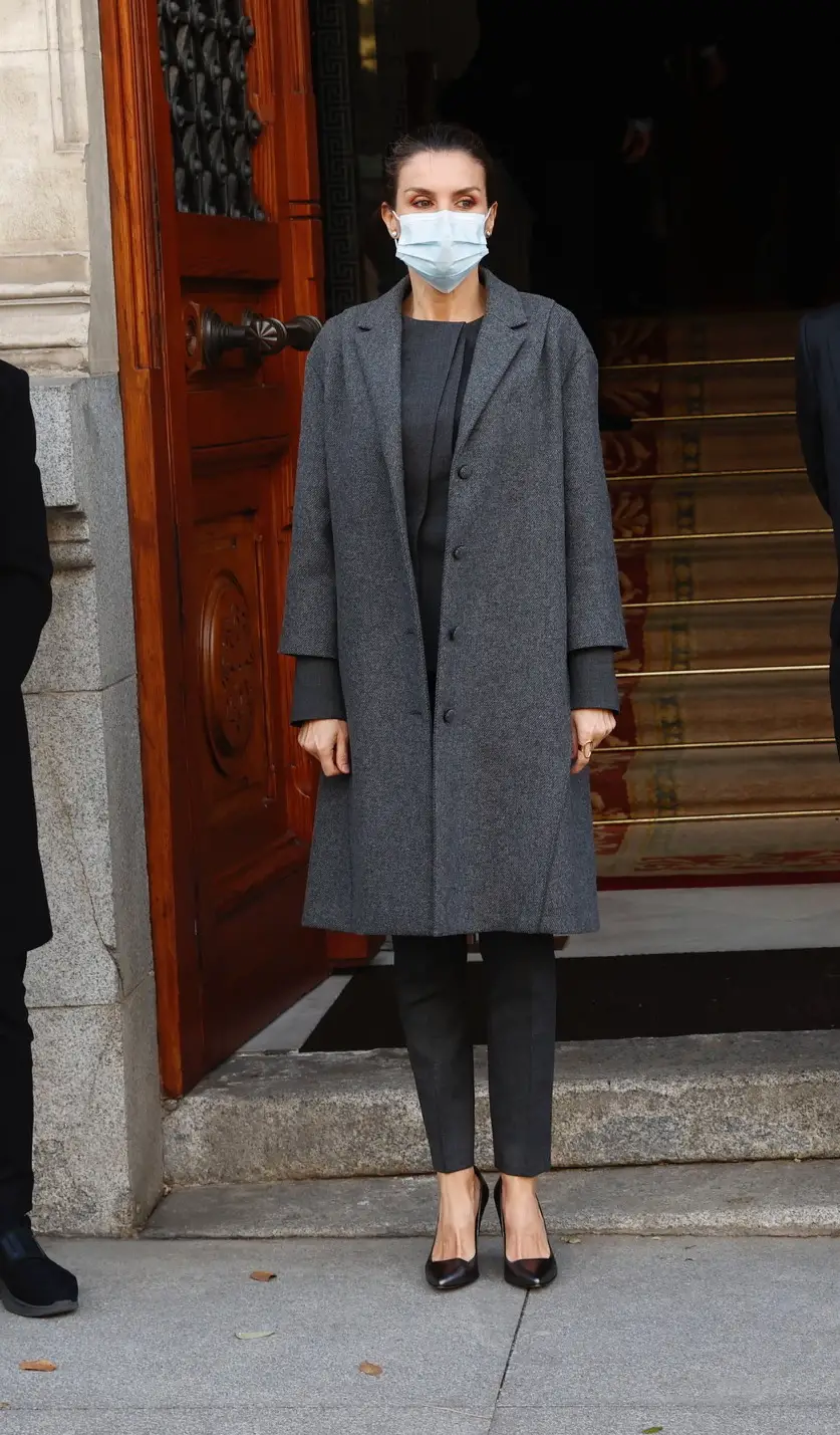 Queen Letizia of Spain wore Nina Ricci Twill Tweed coat and Hugo Boss suit for FundéuRAE meeting