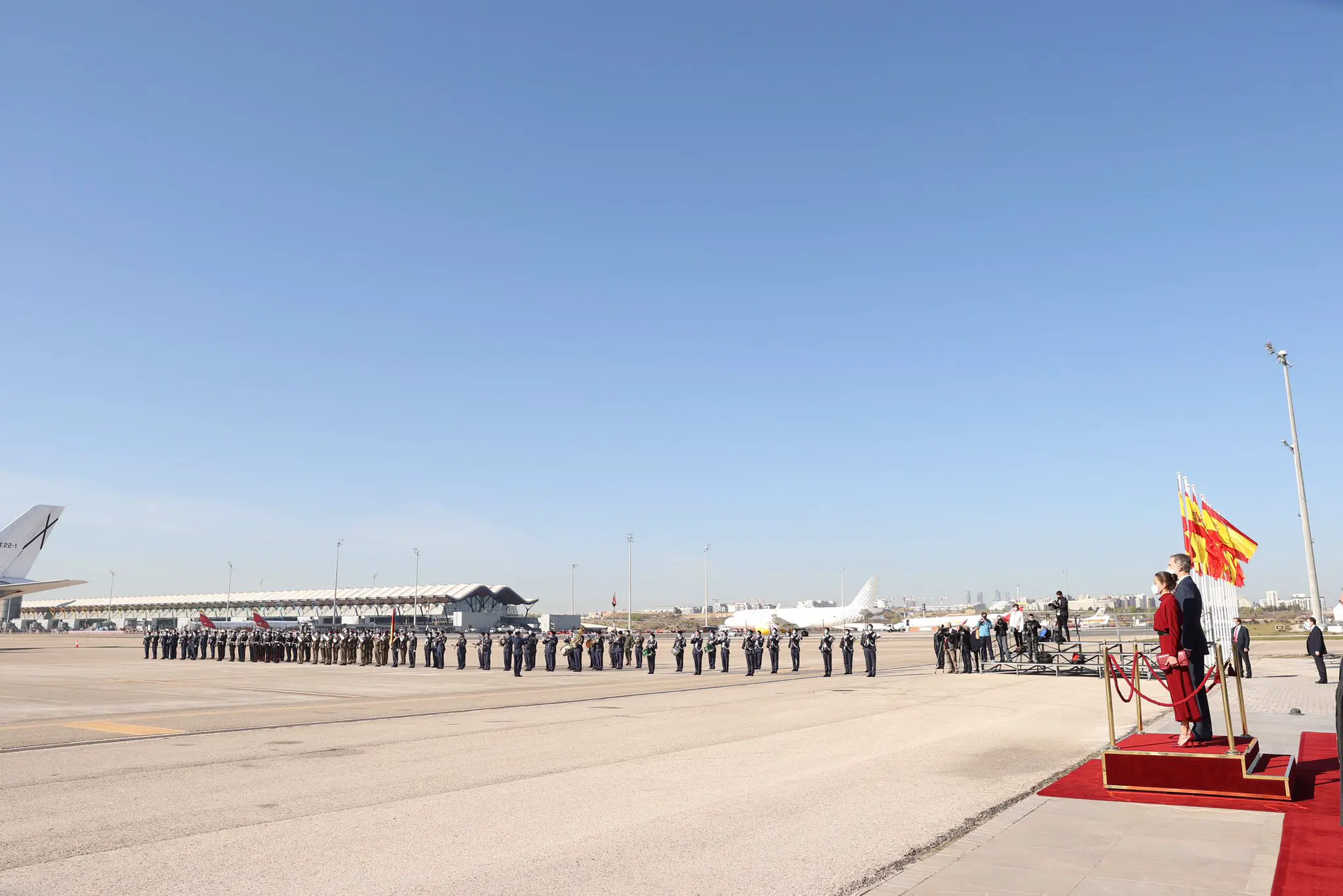 Felipe and Letizia taking the military salute before departing