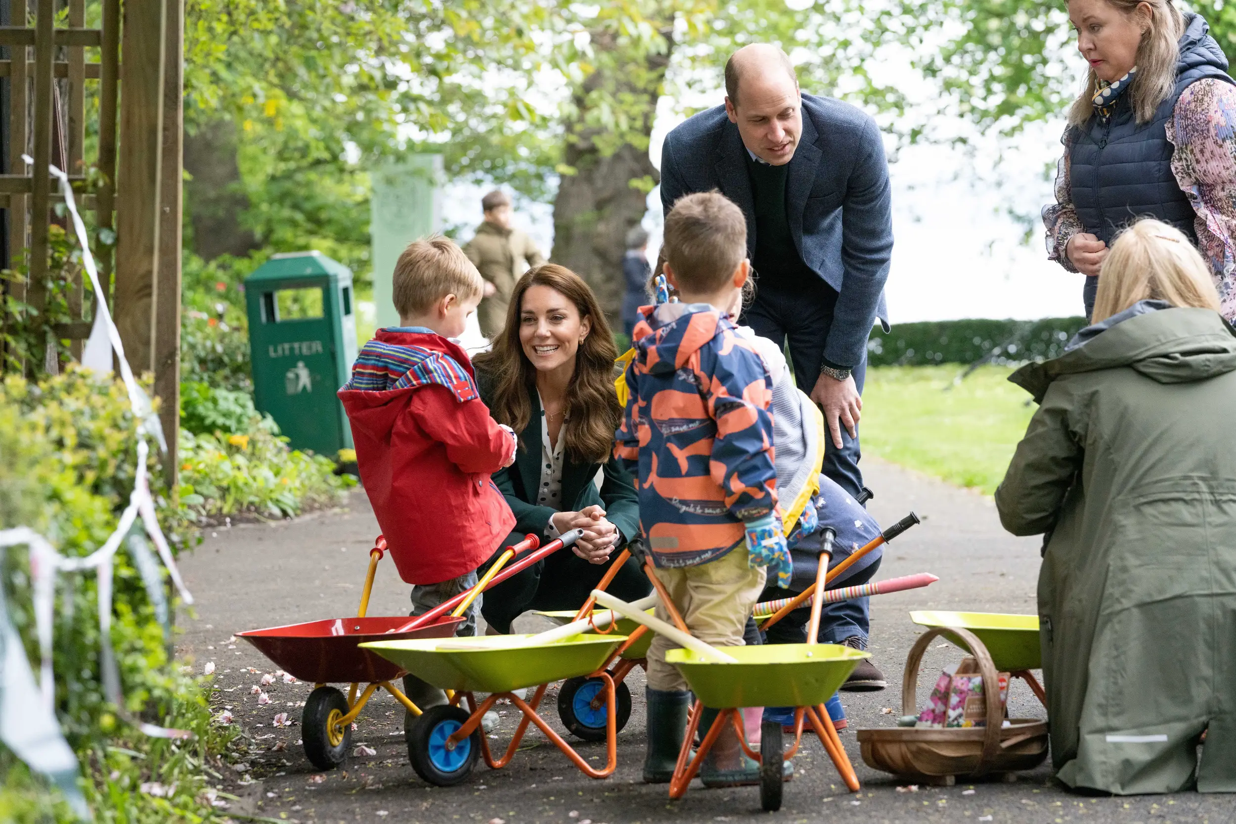 Prince William and Duchess Kate helped nursery children plant seeds good for butterflies on a nature trail in the park.