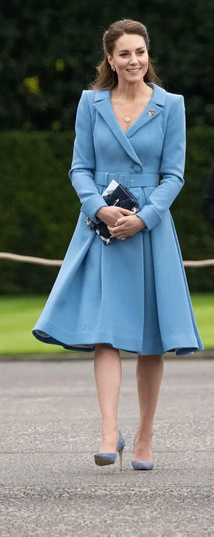 was wearing a blue bespoke Catherine Walker coat dress