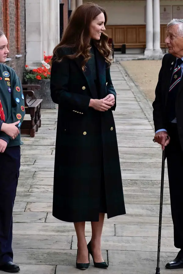 The Duchess of Cambridge wore Holland Cooper Coat with Iris Ink skirt and sweater