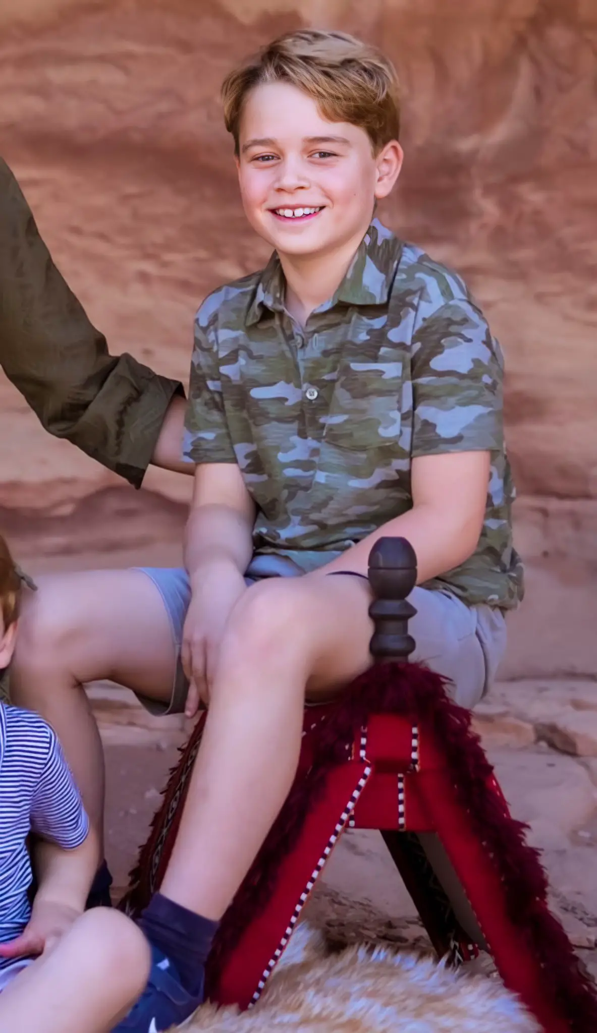 he little future King, Prince George was wearing a £14.95 camo t-shirt from GAP and grey shorts.