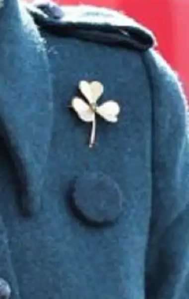 The Duchess of Cambridge topped the outfit Cartier Shamrock Brooch