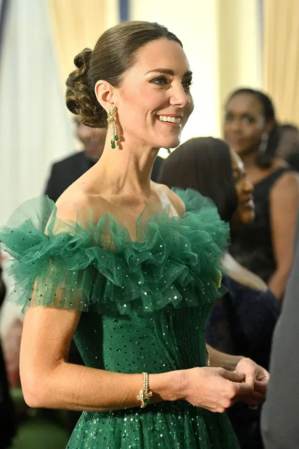 The Duchess of Cambridge is wearing a green Jenny Packham gown with sparkling jewels on loan from Her Majesty The Queen