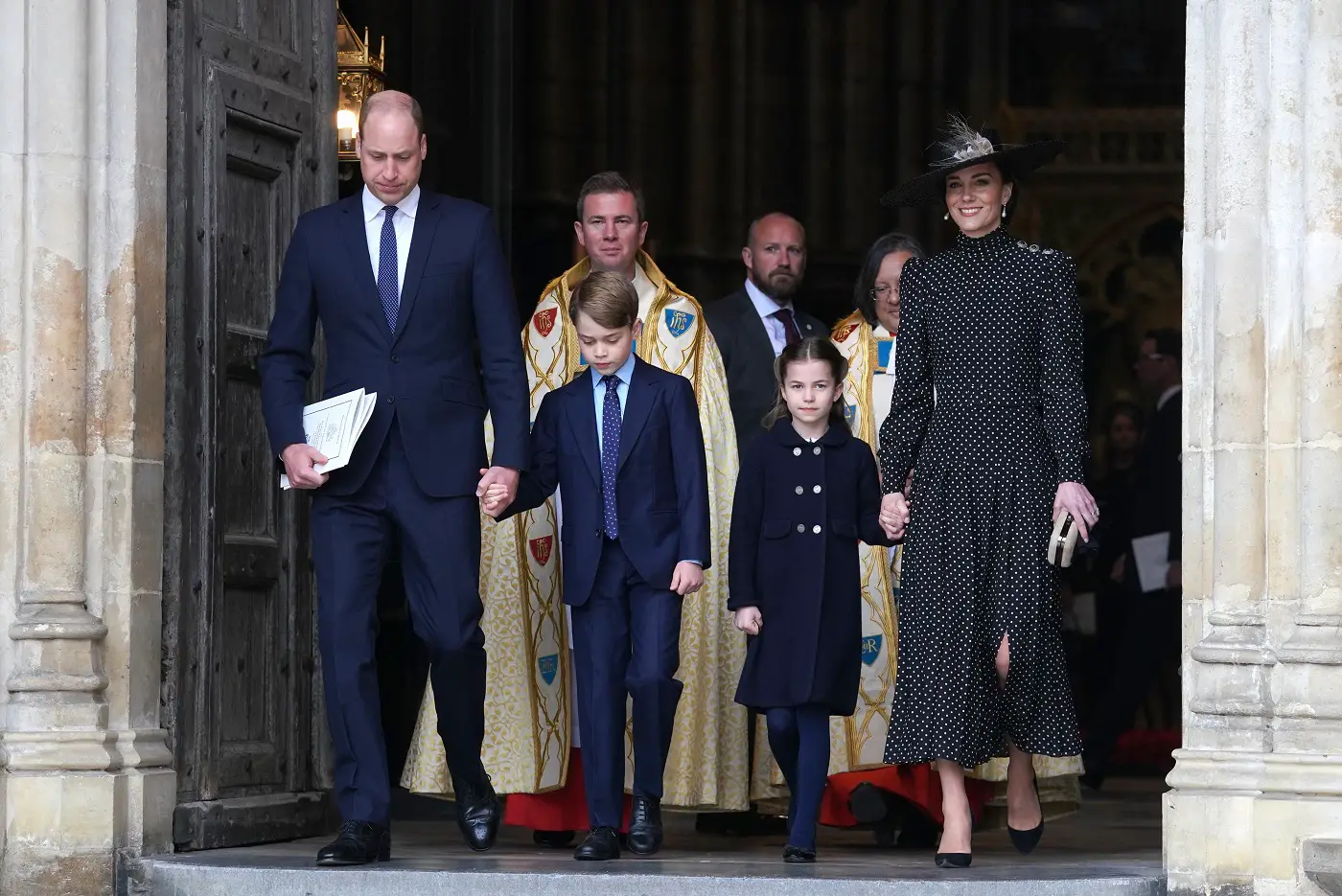The Duchess of Cambridge was wearing a black Alessandra Rich Pleated Polka-dot Silk Crepe De Chine Midi dress