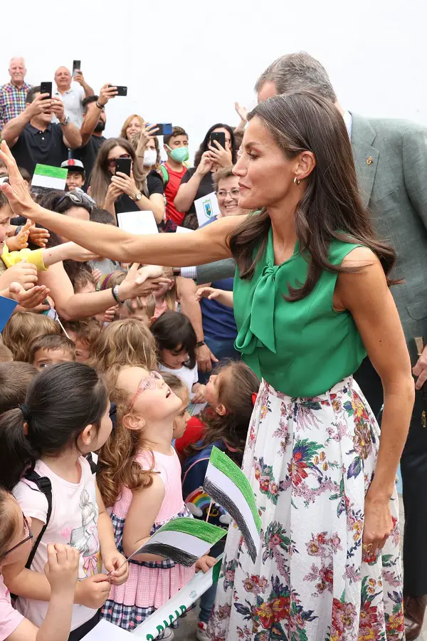 Letizia was wearing her green Carolina Herrera blouse that she first wore in Barcelona in  2011